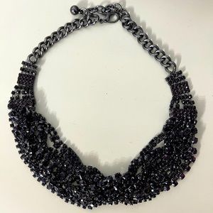 Statement necklace. Gunmetal with reddish black stones.